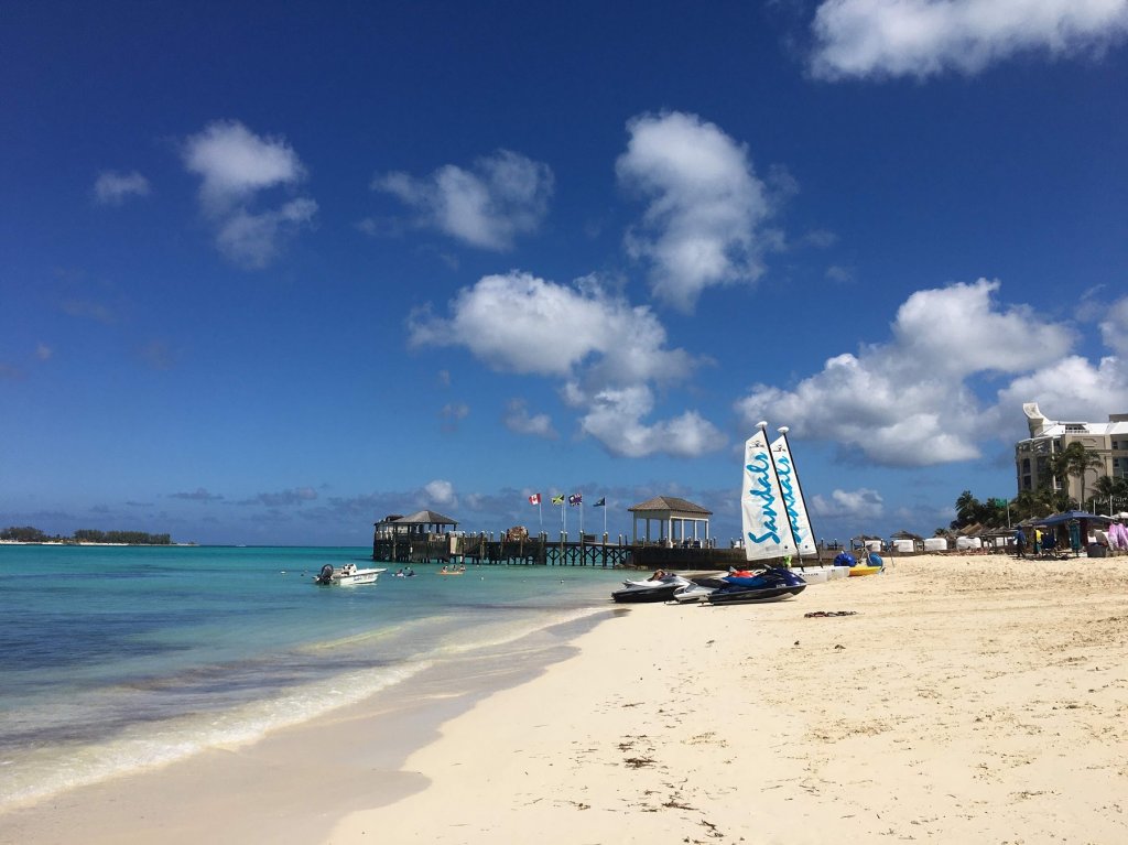 jet skis on sand in front of ocean