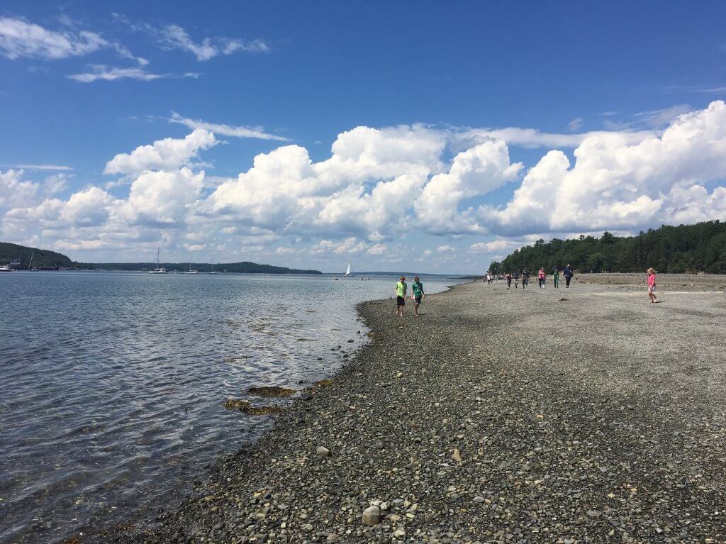 two boys walking on beach