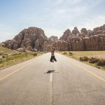 woman jumping in road