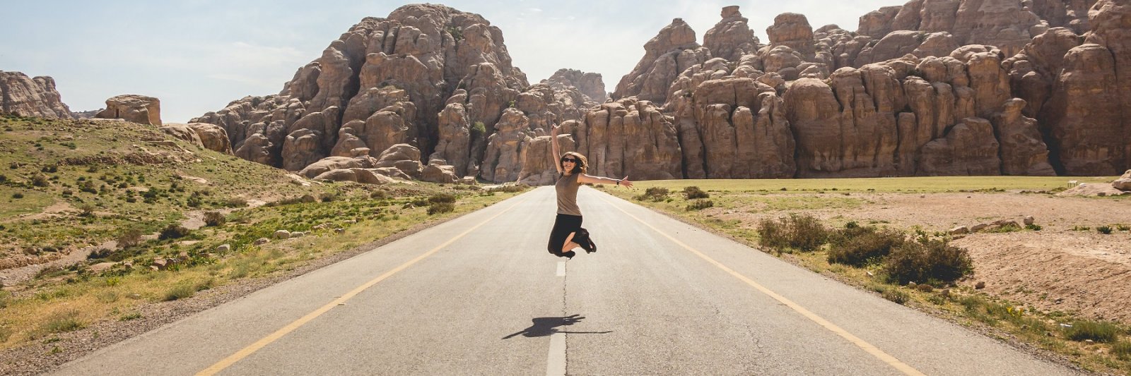 woman jumping in road