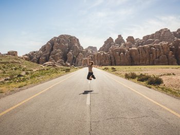 woman jumping in road