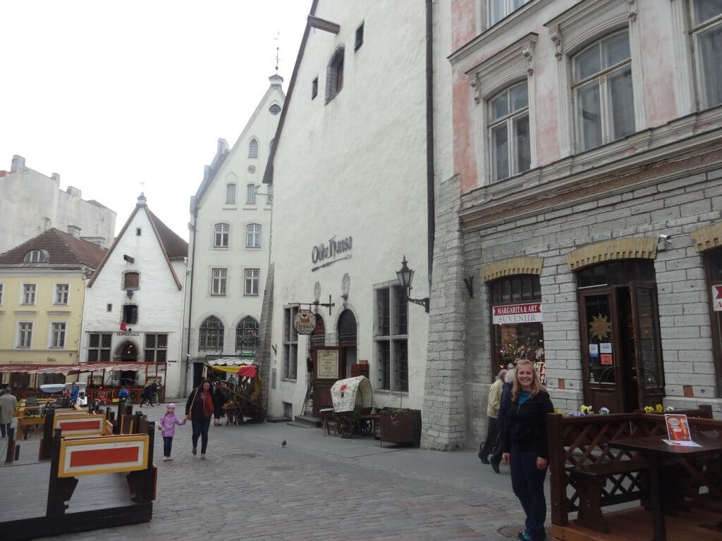 woman in front of old buildings