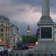 clock tower, lion statues, and tall pillar