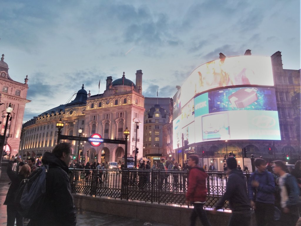 large curved television screen on building