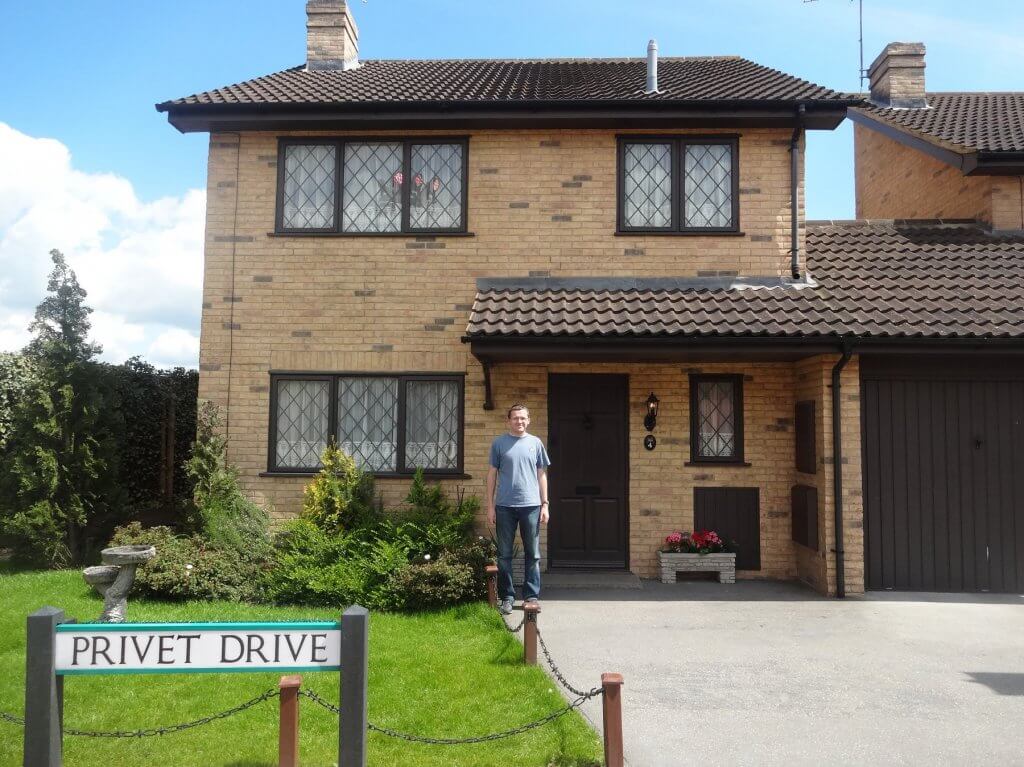 man in front of a house