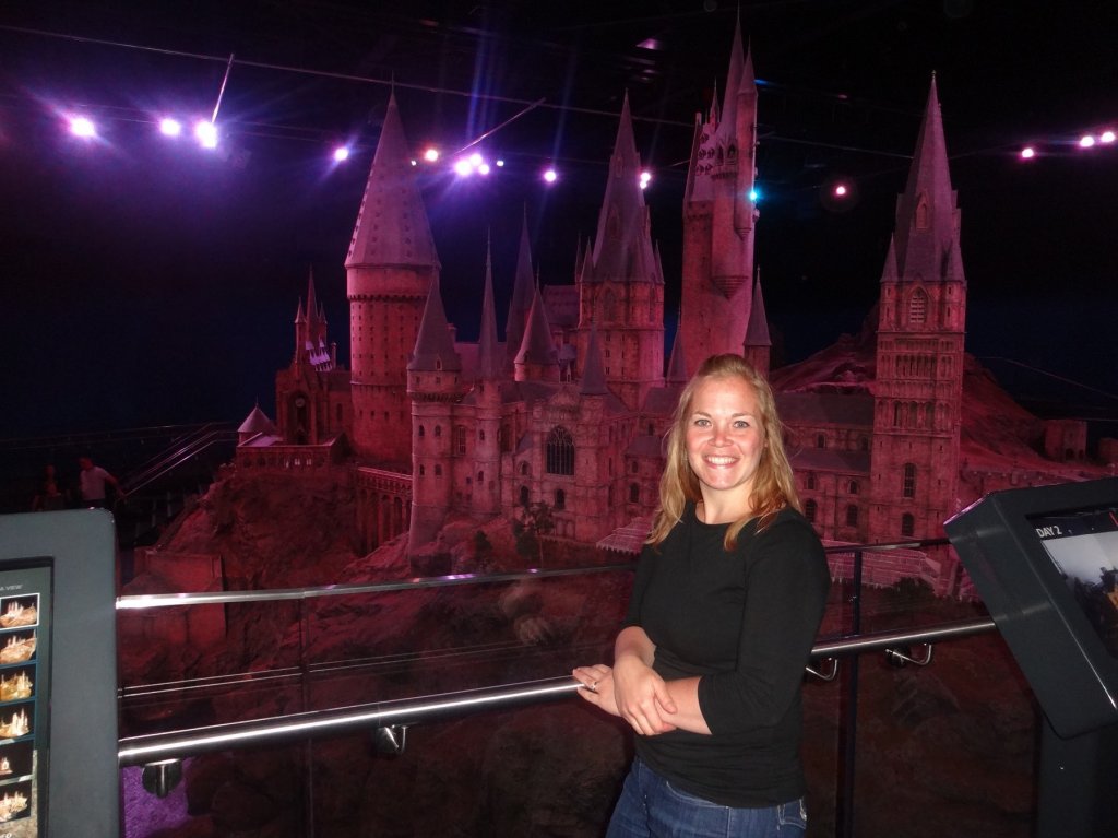 woman in front of castle model