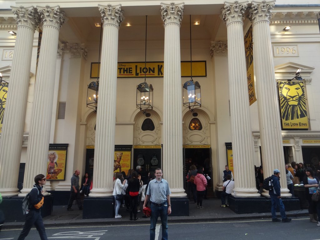 man in front of theater