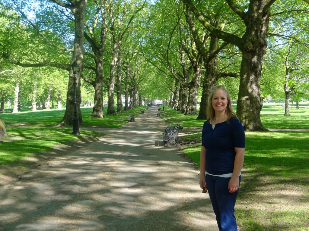 woman on tree-lined path