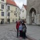 family in front of old buildings