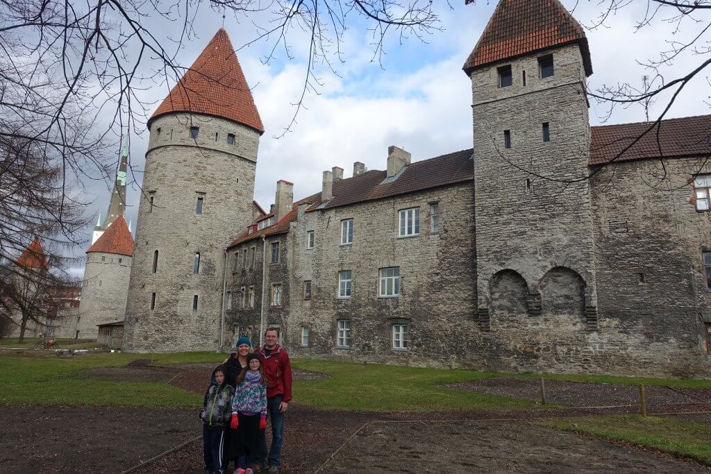 family in front of old building