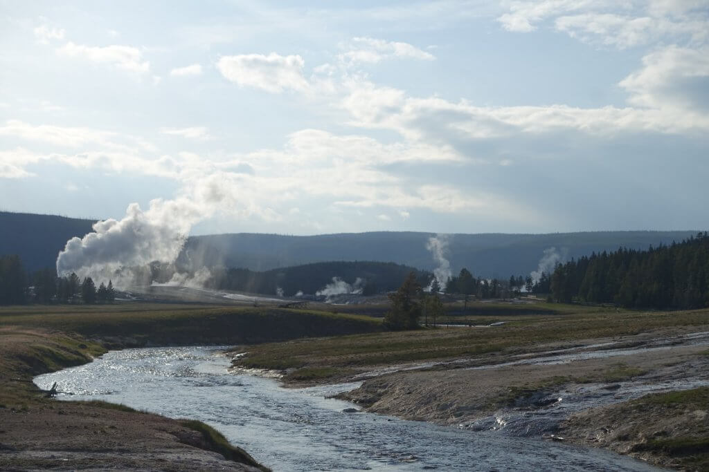 river with steam rising hot springs