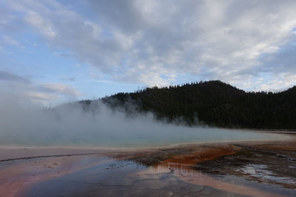 thermal water and steam in front of mountain