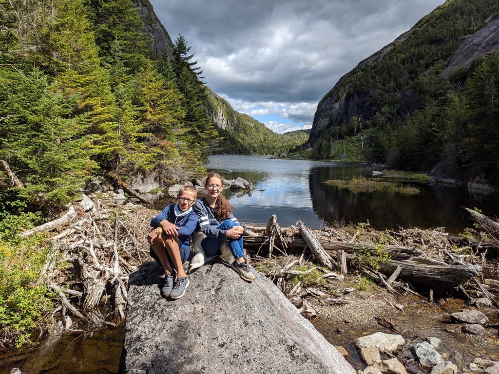 boy and girl on a rock