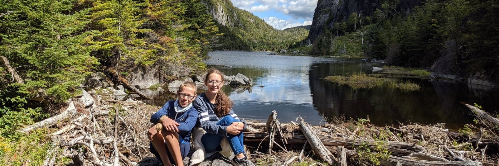 boy and girl on a rock