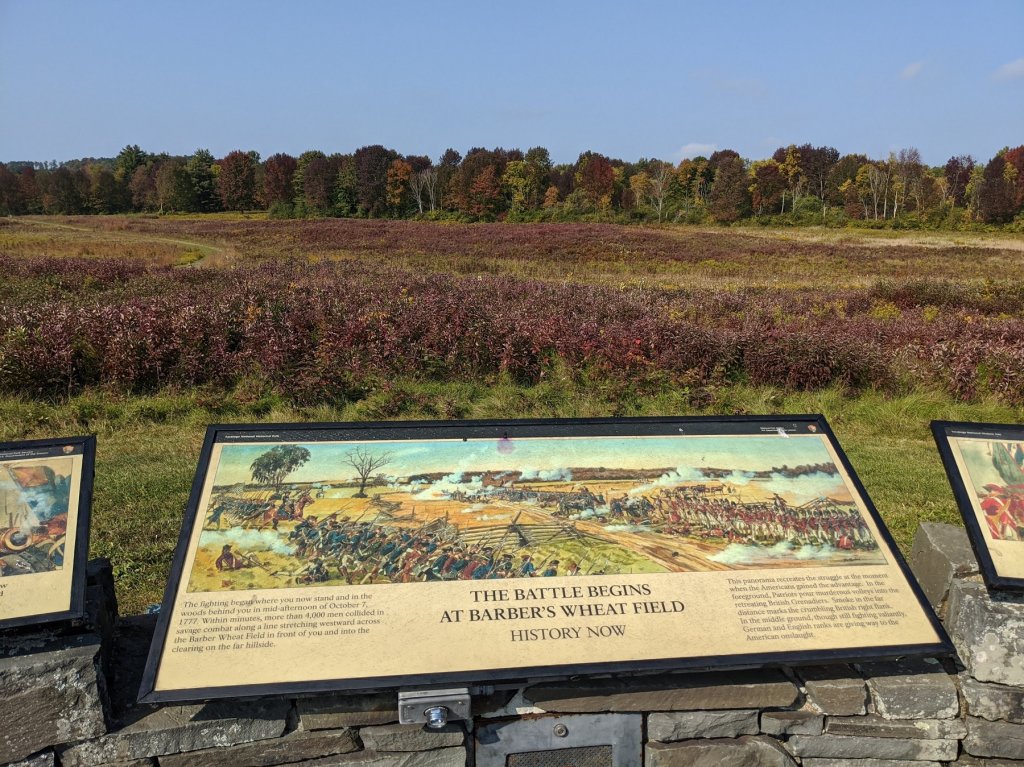 sign with colorful trees