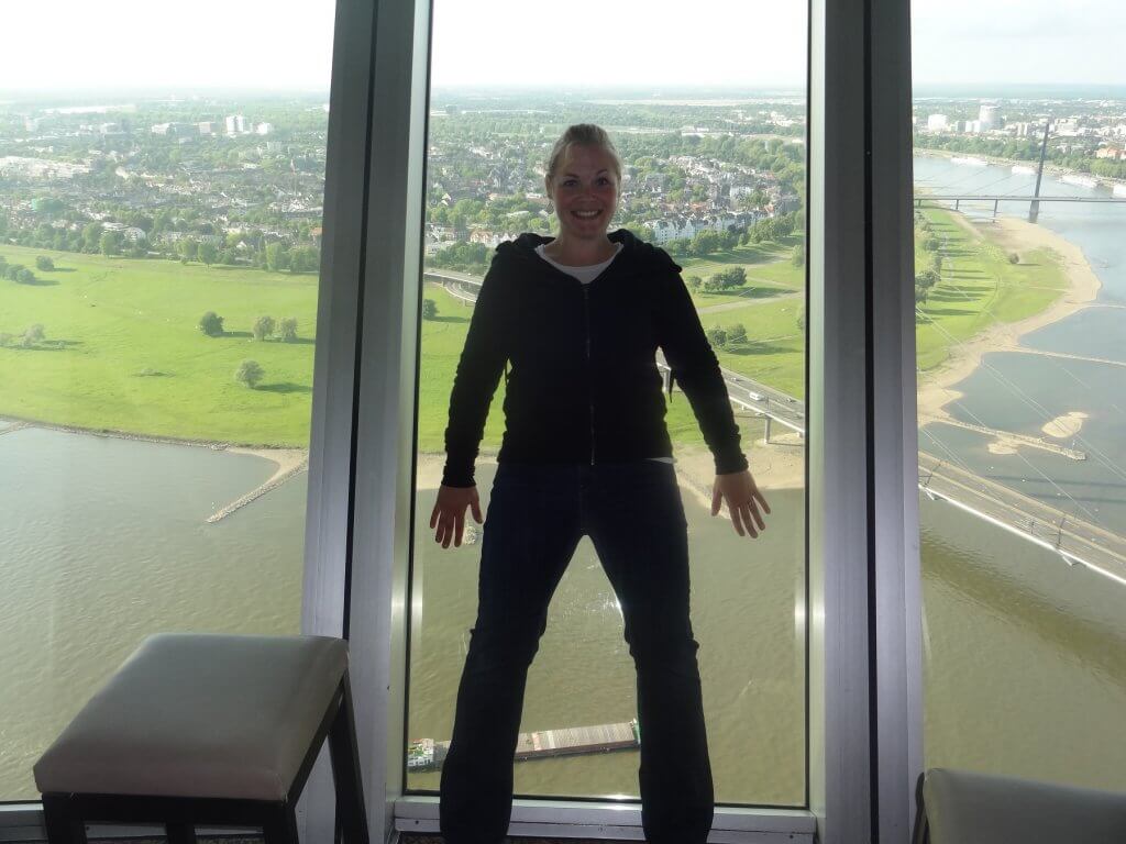 woman leaning on glass