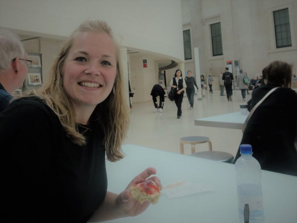 woman with biscuit and jam