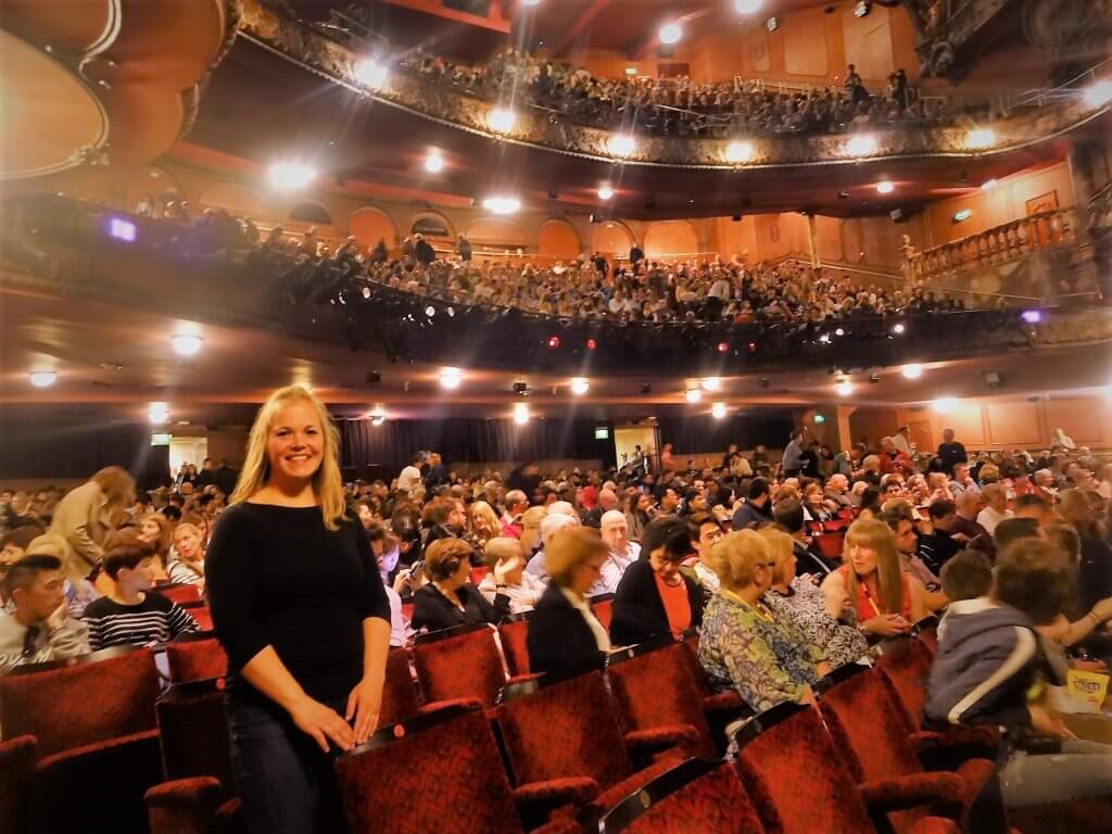 woman inside a crowded theater