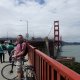 man on bridge with bike