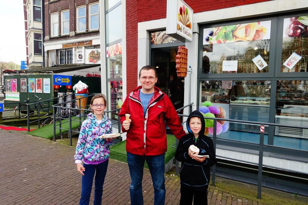 man and kids with sweets