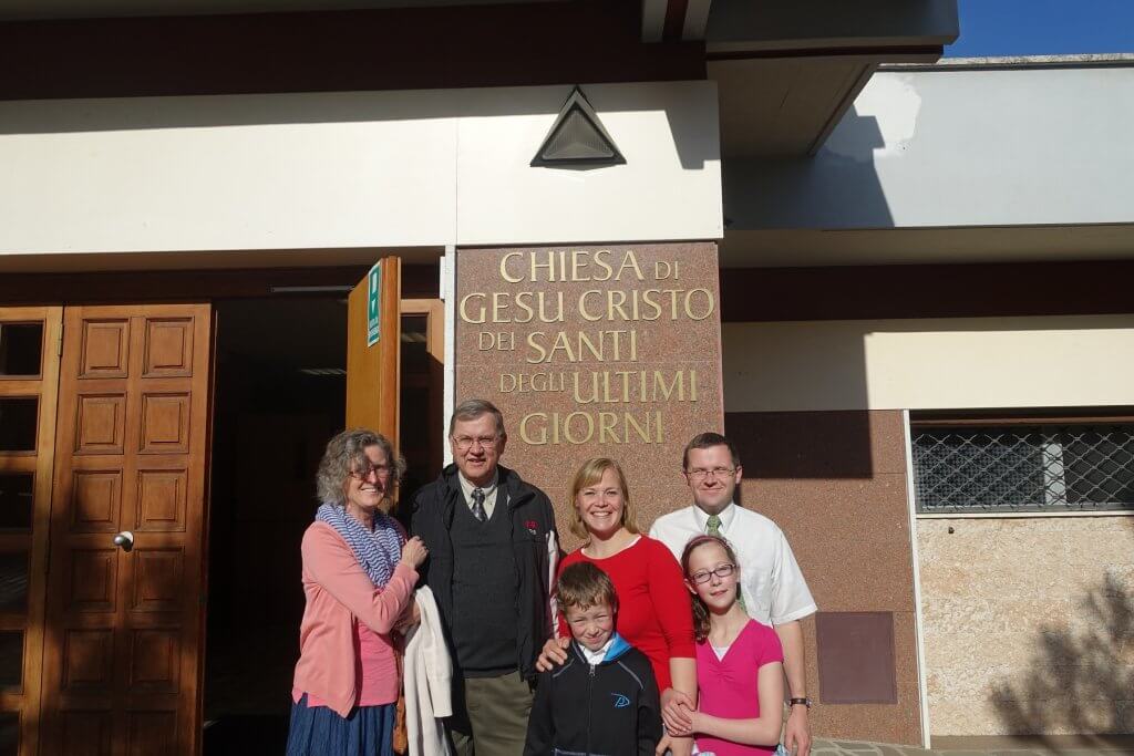 family in front of church