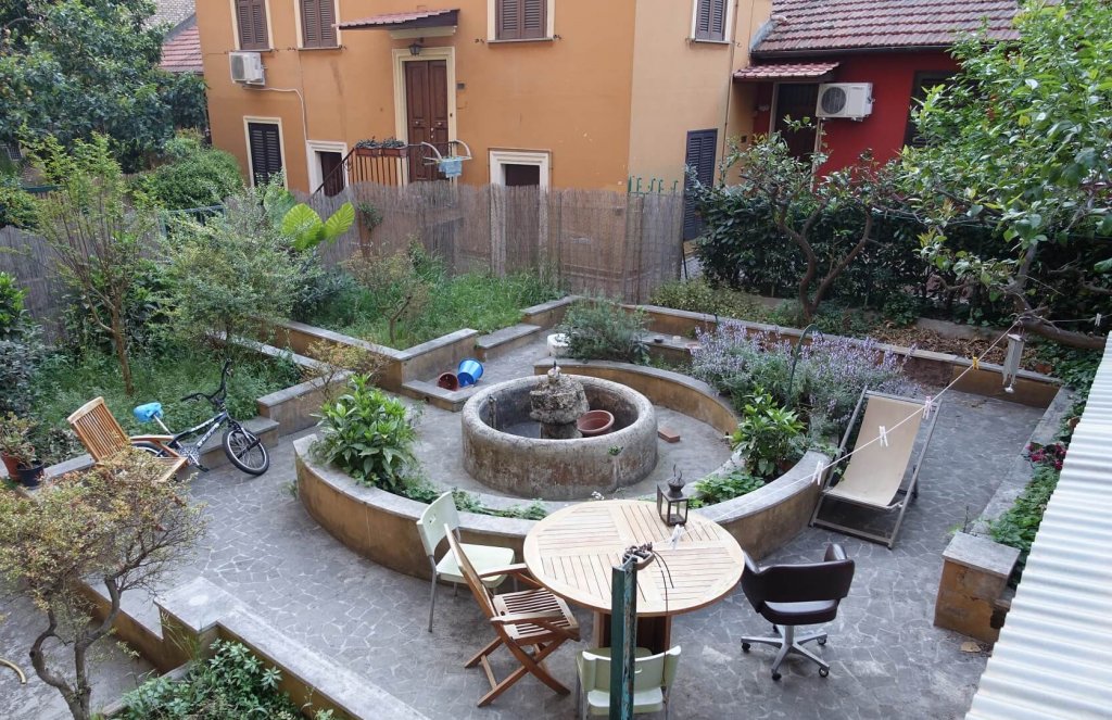 patio with plants and chairs