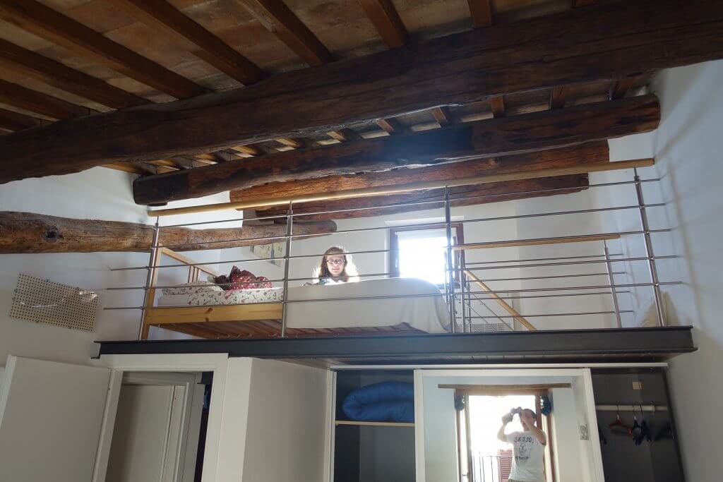 girl on a bed in loft