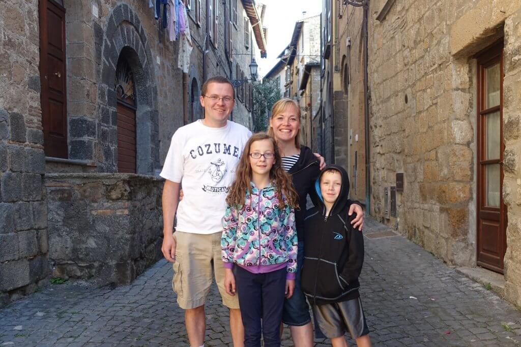 family on cobbled street