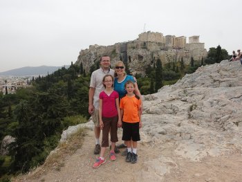 family in front of ancient structures