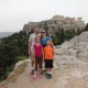 family in front of ancient structures