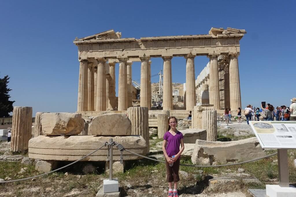 girl in front of ancient building