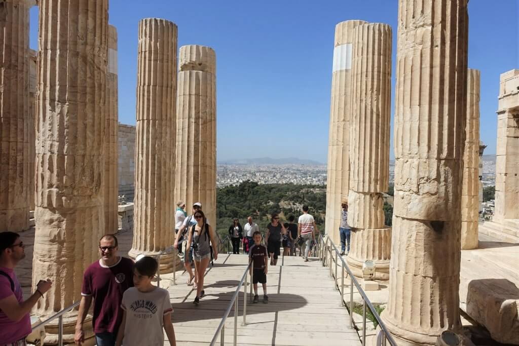 people on path between large columns