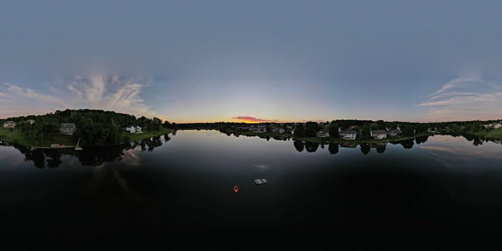 lake with houses and trees