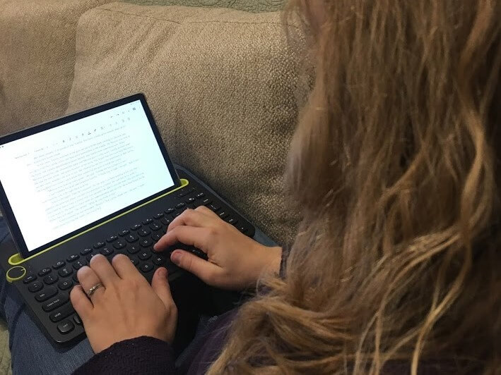 woman typing on keyboard