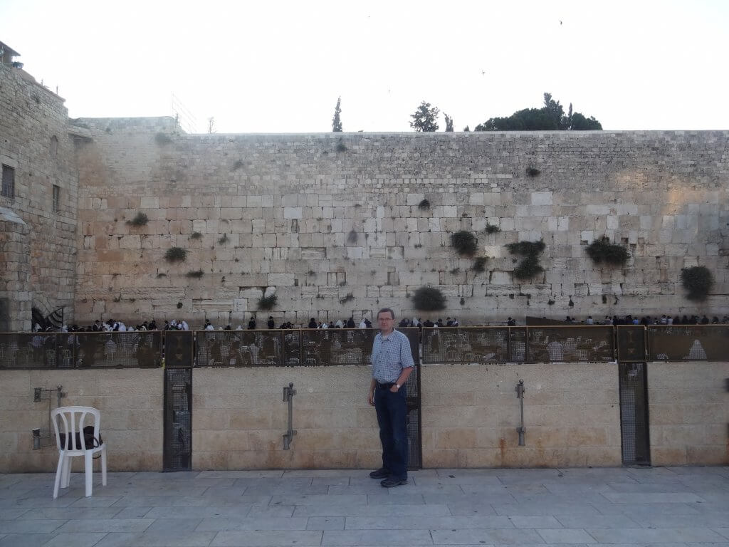 man in front of a wall