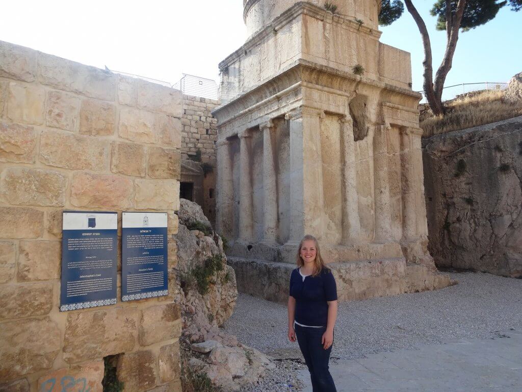 woman in front of ancient tomb