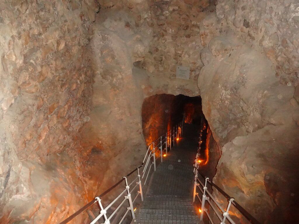 staircase into stone tunnel