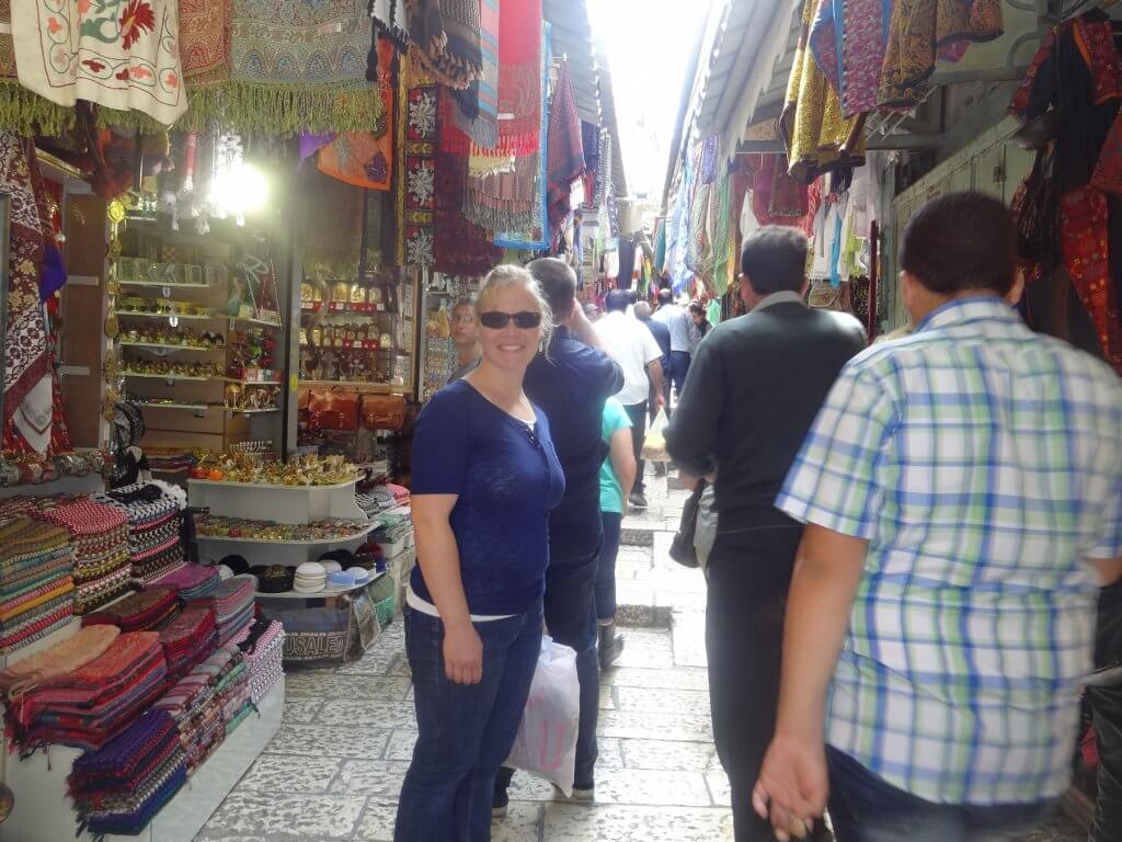 busy market street with colorful fabrics