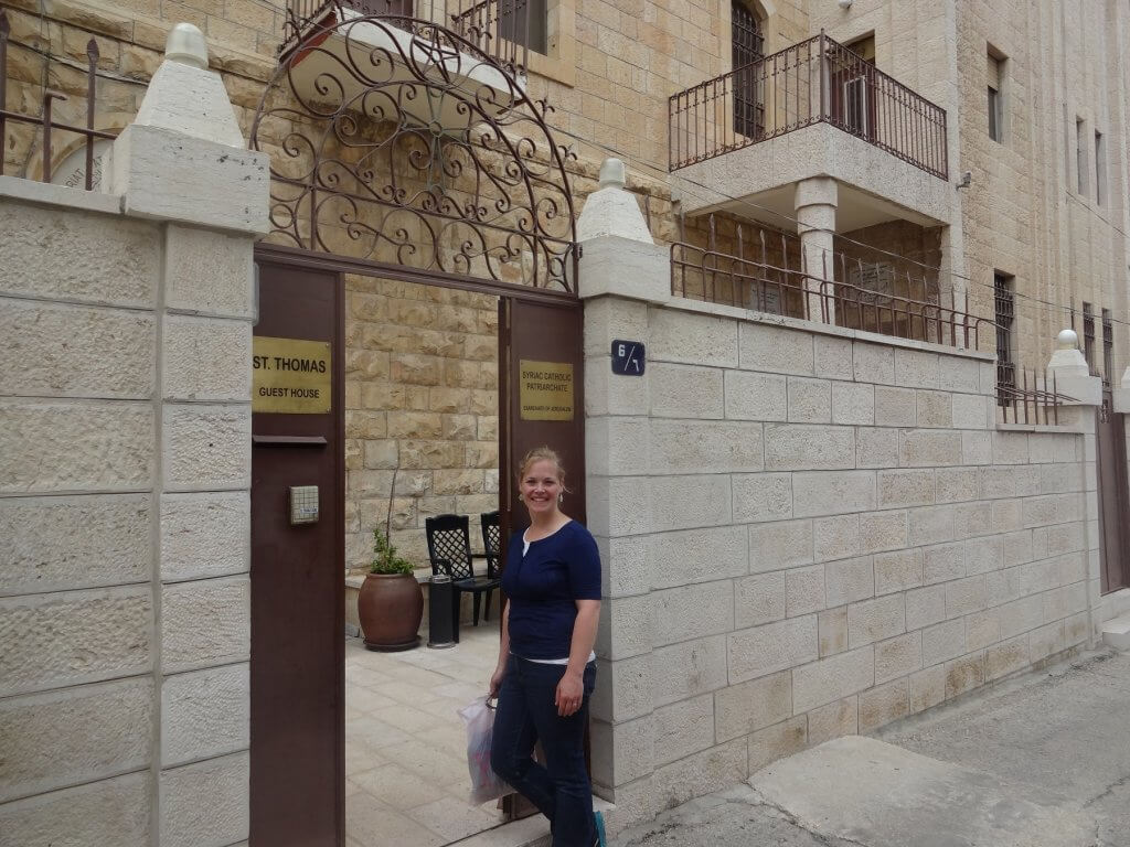 woman at the door of an inn