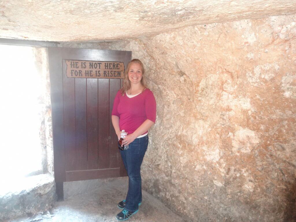 woman standing in tomb by door