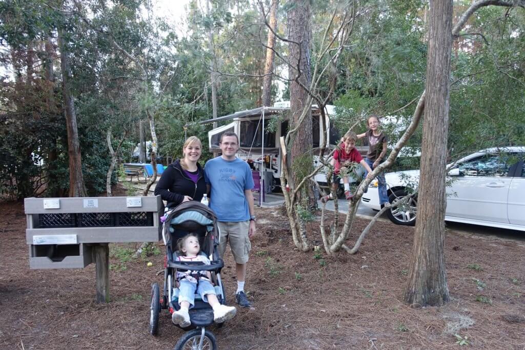 parents and children at campsite