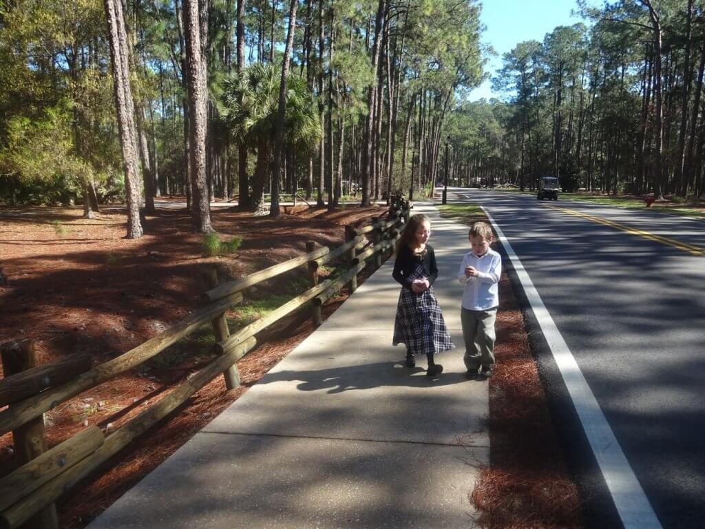 girl and boy on a sidewalk at campground