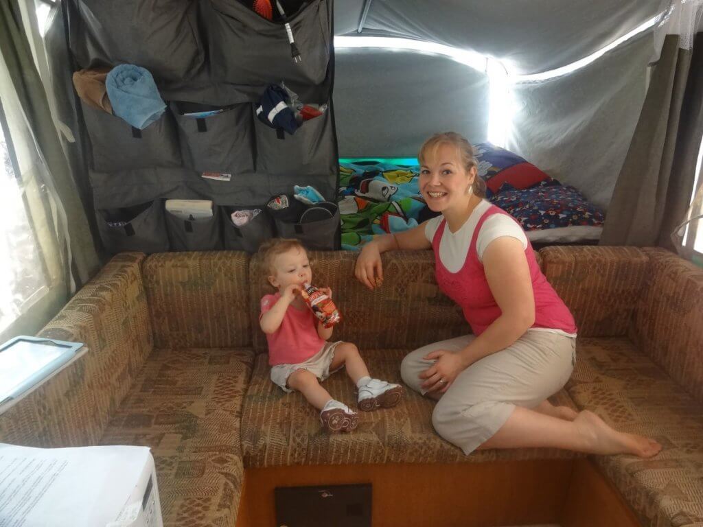 mother and daughter on couch in camper