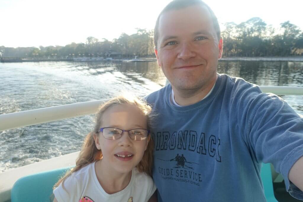 father and daughter on a boat