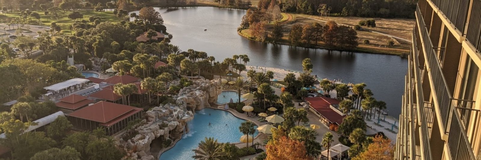 view of pool and lake from hotel room