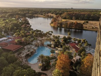 view of pool and lake from hotel room