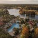 view of pool and lake from hotel room