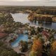 view of pool and lake from hotel room