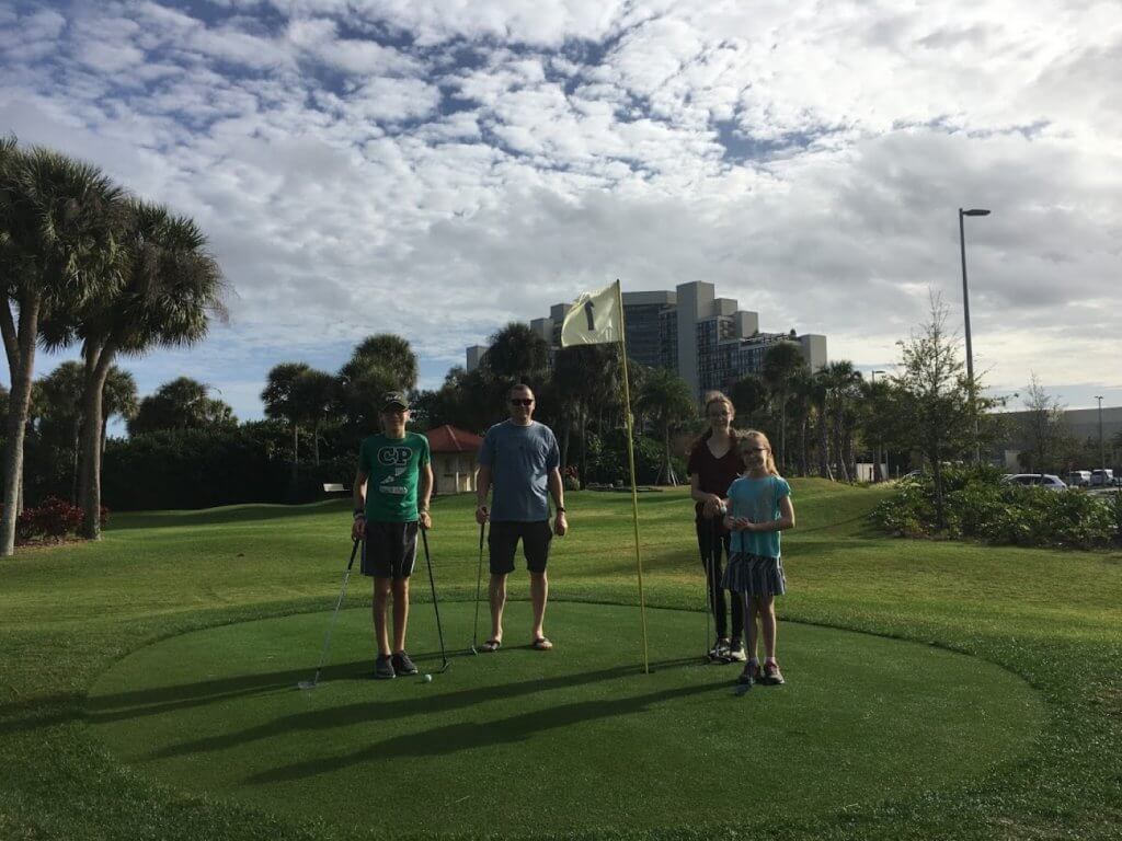 family at golf course