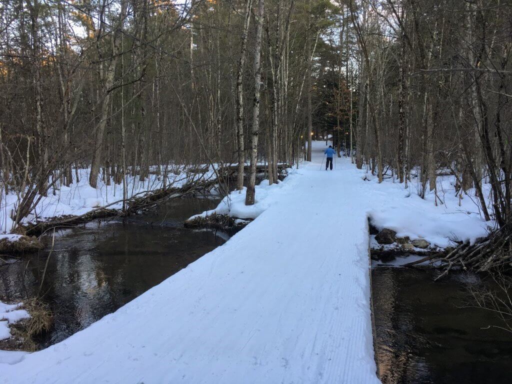 man skiing on snowy path